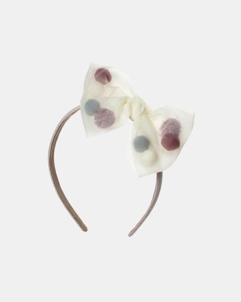 Headband decorated with a bow and pom pon