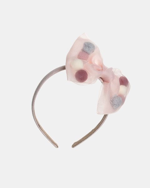 Headband decorated with a bow and pom pon