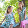 Dress with tropical pattern and ruffles (6-14 years)